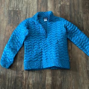 Very light use Patagonia down thin layer packs easily